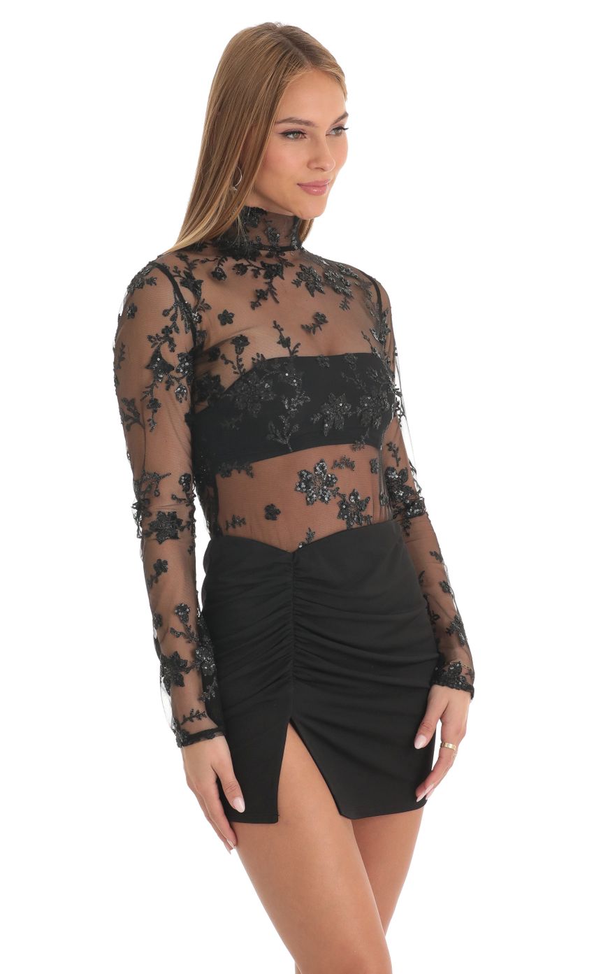Picture Tulle Glitter Sheer Mock Neck Dress in Black. Source: https://media-img.lucyinthesky.com/data/Feb23/850xAUTO/e95f482f-3c5c-4933-991c-5d9137cec2bf.jpg