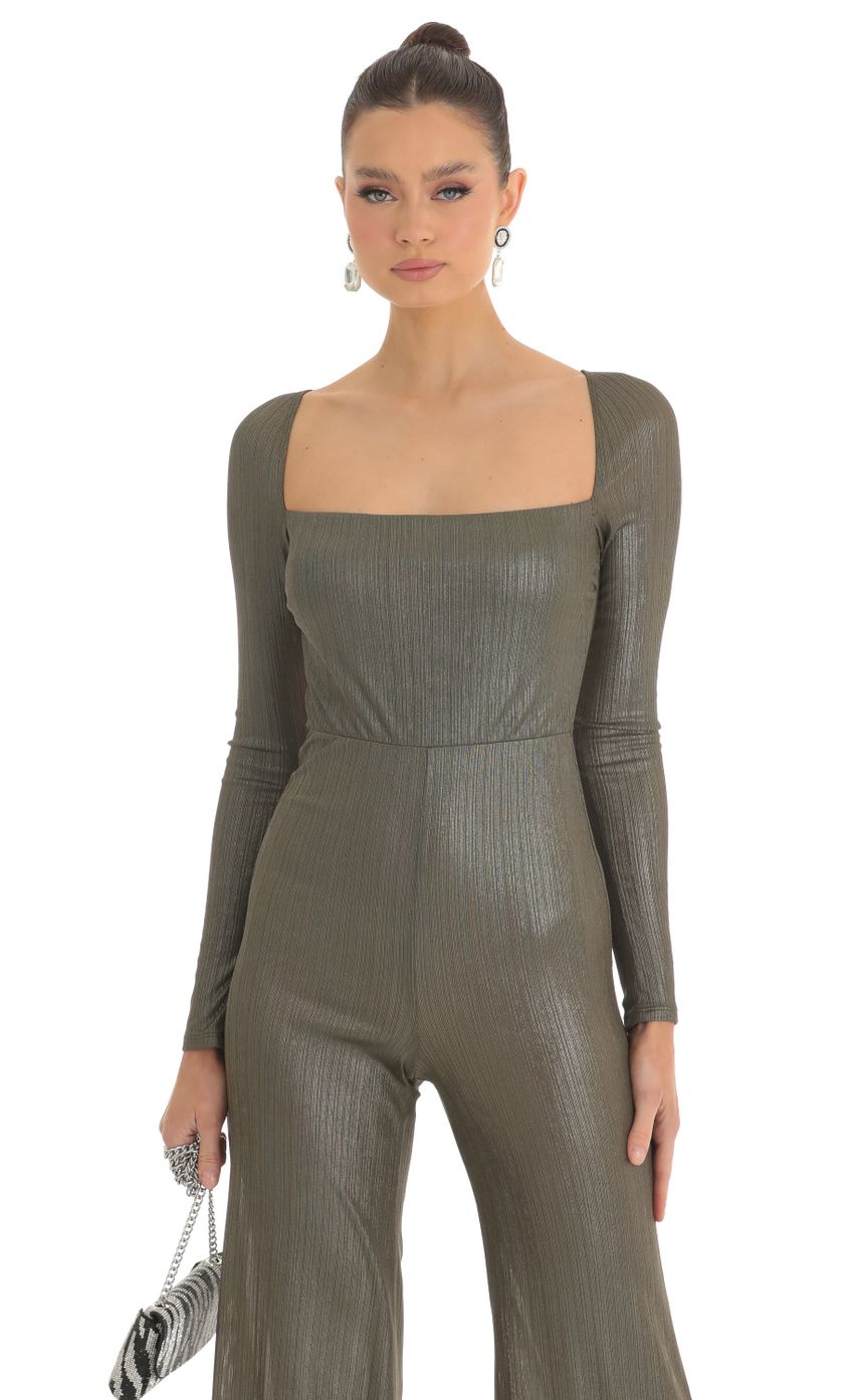 Picture Shimmer Open Back Long Sleeve Jumpsuit in Olive. Source: https://media-img.lucyinthesky.com/data/Feb23/850xAUTO/f659c74c-97ea-4d6b-ad62-7fbe9e707406.jpg