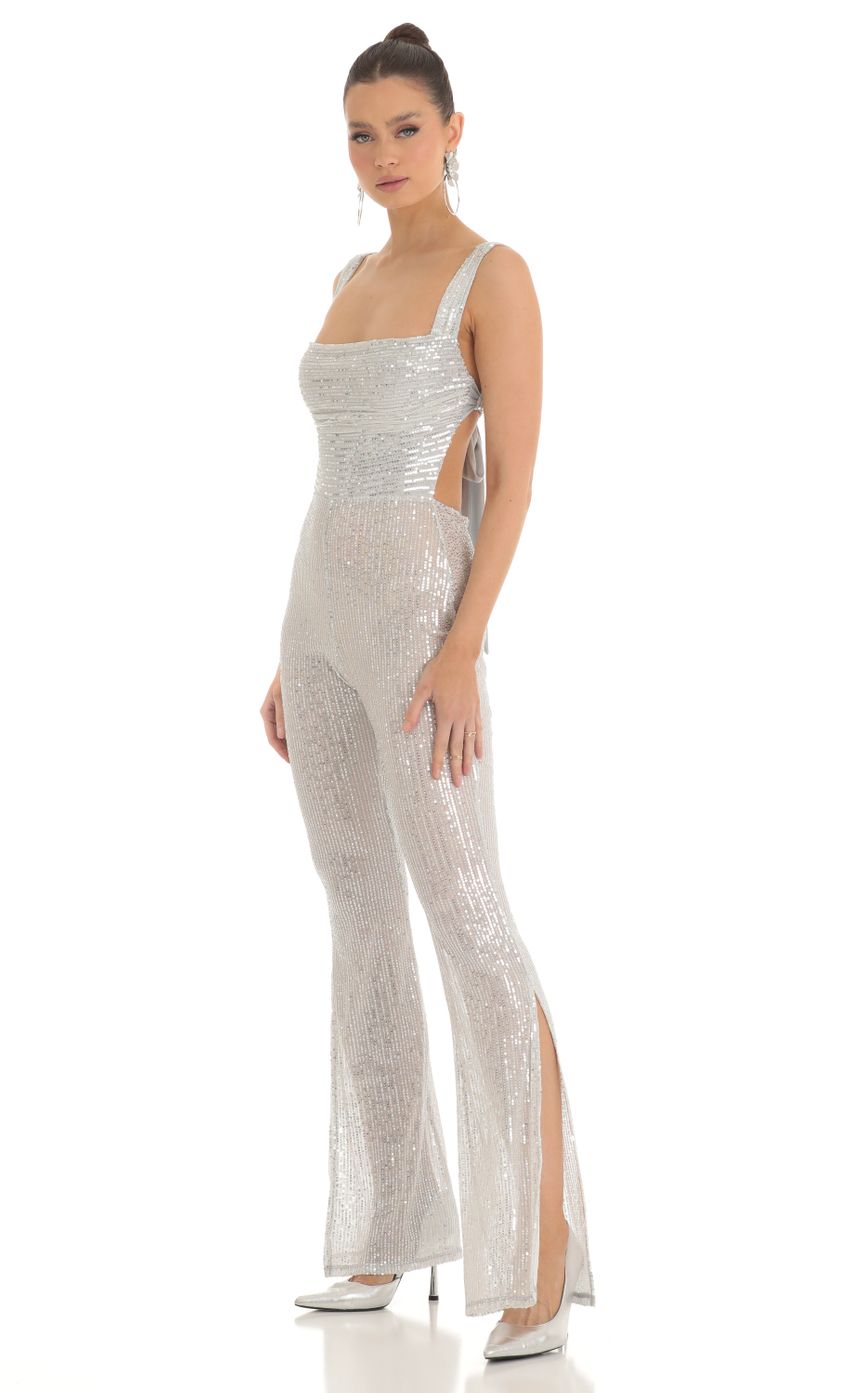 Picture Sequin Wide Leg Slit Jumpsuit in Silver. Source: https://media-img.lucyinthesky.com/data/Feb23/850xAUTO/febbc62c-d725-4761-9dd8-22b684fc2871.jpg