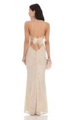 Picture Iridescent Sequin Strapless Maxi Dress in Champagne. Source: https://media-img.lucyinthesky.com/data/Feb24/150xAUTO/07f59649-4774-4c45-8ff5-d22e3d078b8a.jpg