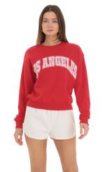 Picture Los Angeles Jumper in Red. Source: https://media-img.lucyinthesky.com/data/Feb24/150xAUTO/4d260105-a1cb-4e93-b95e-d44cb216c2ce.jpg