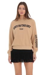 Picture Lucy in the Sky Crew Jumper in Brown. Source: https://media-img.lucyinthesky.com/data/Feb24/150xAUTO/4d8da60c-a00e-44df-98ef-ae74ad0363d0.jpg