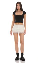 Picture Lace Ruffle Skort in White. Source: https://media-img.lucyinthesky.com/data/Feb24/150xAUTO/50d8472e-90f3-4572-bee8-5c39b8acf314.jpg
