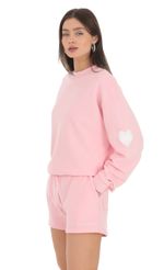 Picture Embroidered Lucy in the Sky Jumper in Pink. Source: https://media-img.lucyinthesky.com/data/Feb24/150xAUTO/7a720324-f33b-4dbb-9f96-9d970fda1a21.jpg