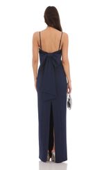 Picture Back Bow Maxi Dress in Navy. Source: https://media-img.lucyinthesky.com/data/Feb24/150xAUTO/83418438-bab4-4c54-b0e4-89231f638020.jpg