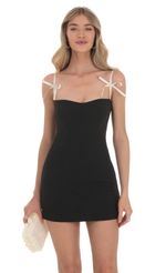 Picture Bow Ties Bodycon Dress in Black. Source: https://media-img.lucyinthesky.com/data/Feb24/150xAUTO/a735eaa2-1c86-4c9b-9ef9-64c2458112a8.jpg