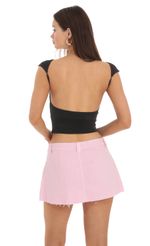 Picture High Neck Open Back Top in Black. Source: https://media-img.lucyinthesky.com/data/Feb24/150xAUTO/b4311850-f259-4b41-8930-fa531d88416f.jpg