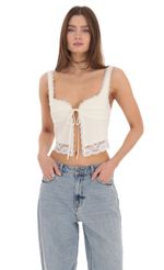 Picture Lace Vest Top in Cream. Source: https://media-img.lucyinthesky.com/data/Feb24/150xAUTO/e1dff96a-bf80-49f2-8d29-fc56dda10482.jpg