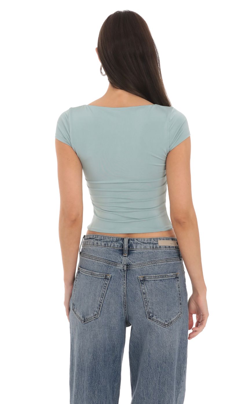 Picture Short Sleeve Crop Top in Seaglass Blue. Source: https://media-img.lucyinthesky.com/data/Feb24/850xAUTO/09ed59d3-6456-4472-b1ae-ca68ae3d0e7c.jpg
