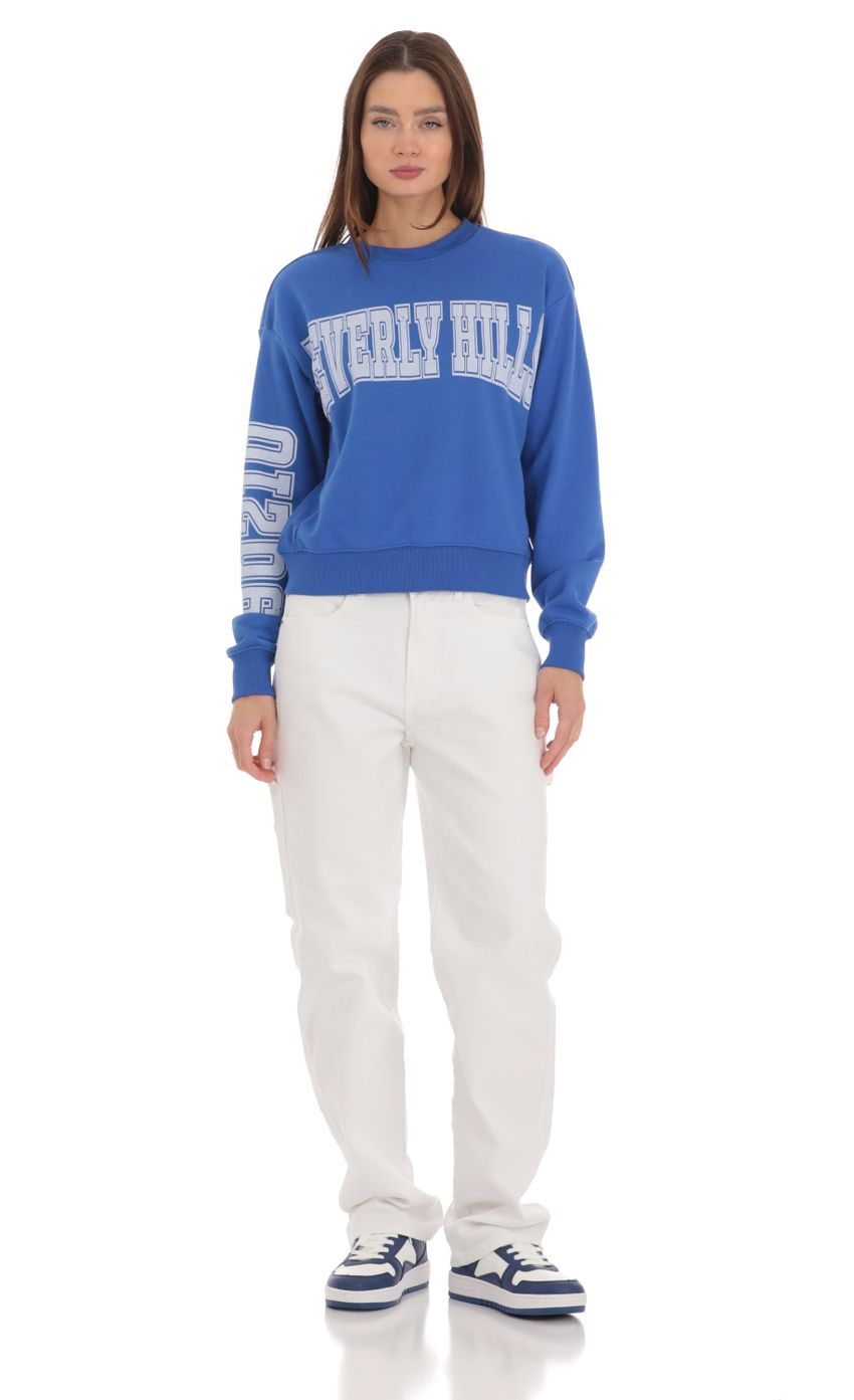 Picture Beverly Hills 90210 Jumper in Blue. Source: https://media-img.lucyinthesky.com/data/Feb24/850xAUTO/0ca91bd2-27cd-4b7e-89c5-951922365200.jpg