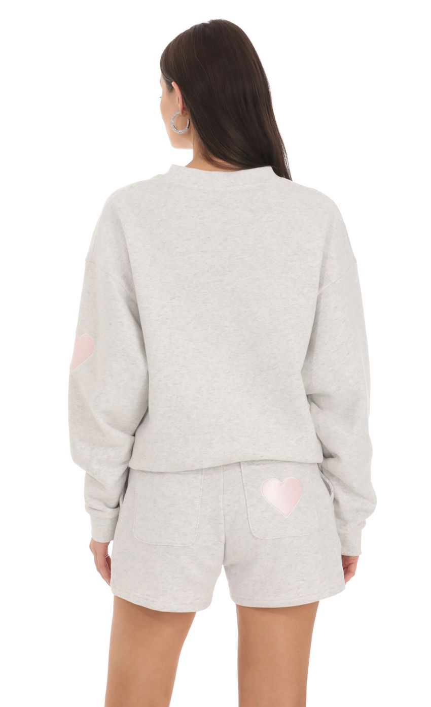 Picture Embroidered Lucy in the Sky Jumper in Grey. Source: https://media-img.lucyinthesky.com/data/Feb24/850xAUTO/0e8abed6-2ce8-4f81-8d5f-45d011ac2ce8.jpg