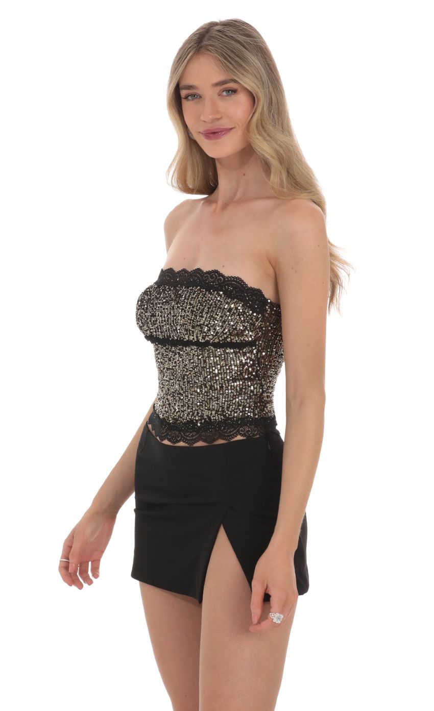 Picture Strapless Gold Sequin Top in Black. Source: https://media-img.lucyinthesky.com/data/Feb24/850xAUTO/0ed835d7-6639-472e-9d11-45626c1b5bd2.jpg