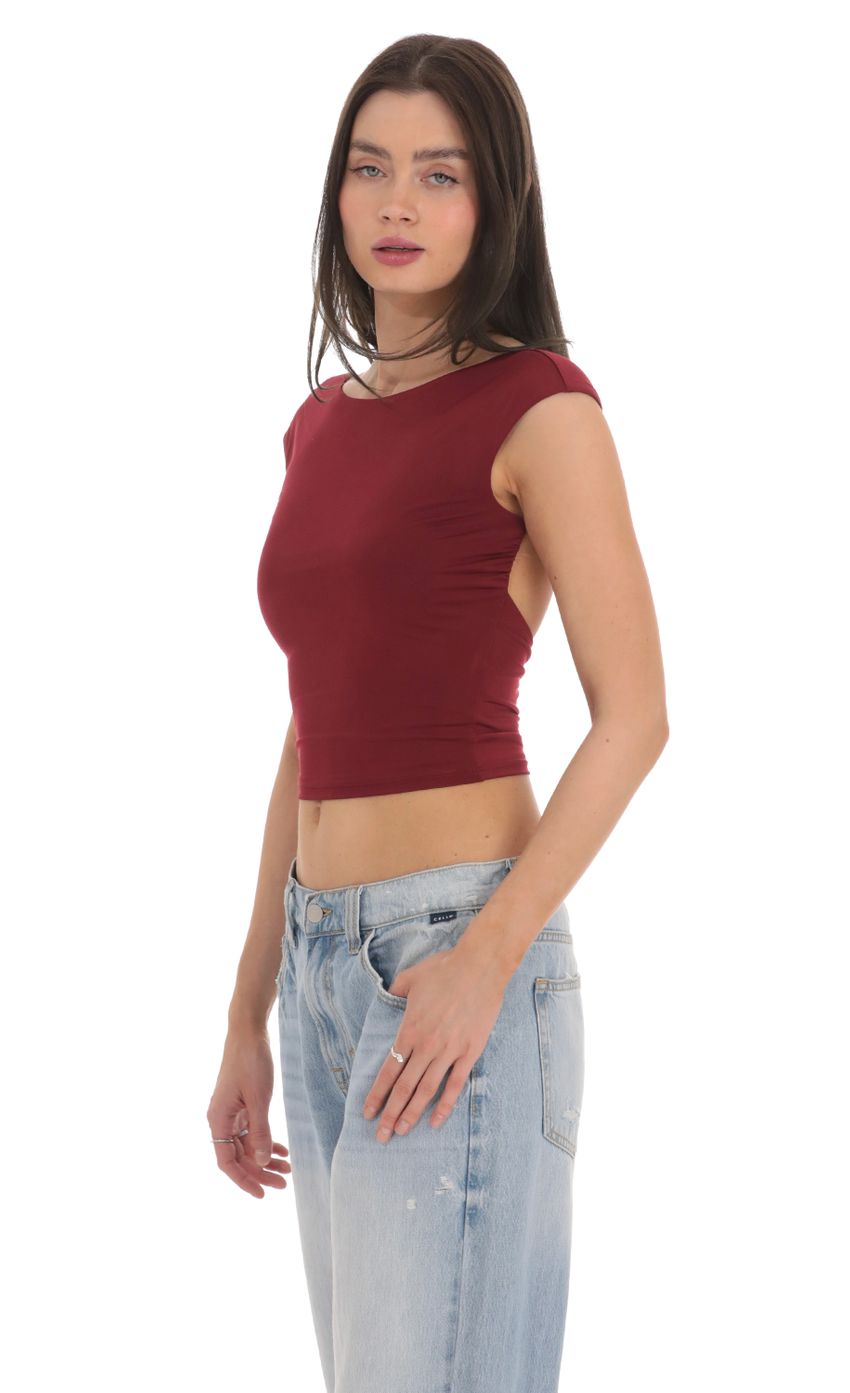 Picture High Neck Open Back Top in Maroon. Source: https://media-img.lucyinthesky.com/data/Feb24/850xAUTO/14403a5a-4ef7-4b40-a658-6a99268e0425.jpg