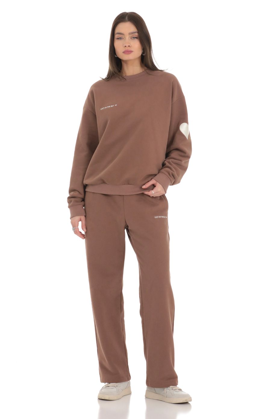 Picture Heart Pocket Sweatpants in Brown. Source: https://media-img.lucyinthesky.com/data/Feb24/850xAUTO/22e33436-d521-4a11-98af-8553e54b4a32.jpg