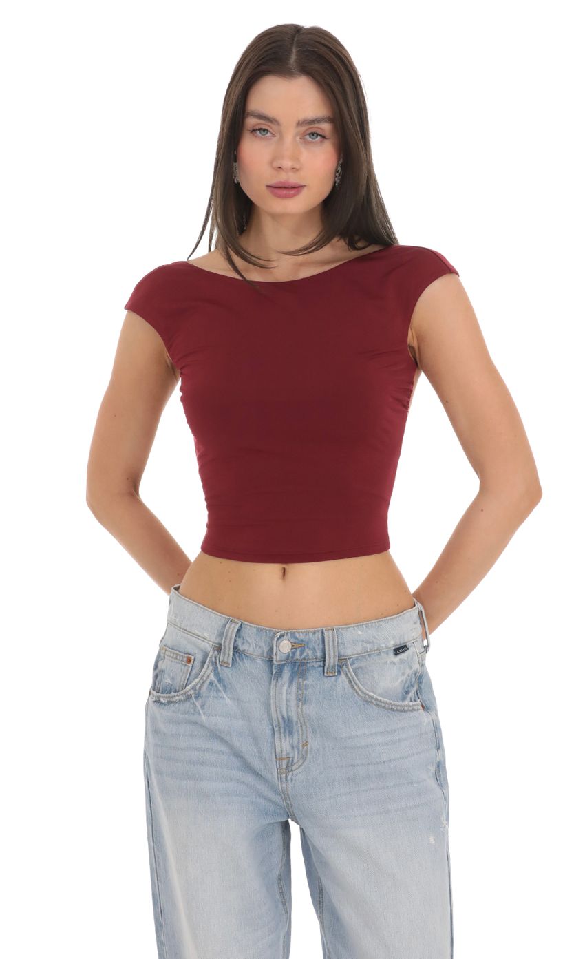 Picture High Neck Open Back Top in Maroon. Source: https://media-img.lucyinthesky.com/data/Feb24/850xAUTO/23ab725a-2b38-48d4-a702-743e7071e04b.jpg