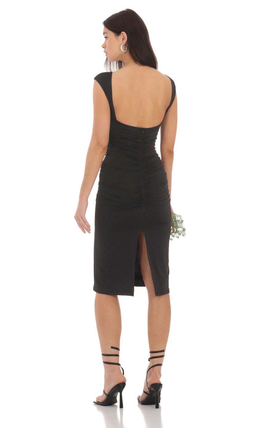 Picture Open Back Ruched Midi Dress in Black. Source: https://media-img.lucyinthesky.com/data/Feb24/850xAUTO/25022bf1-773b-422f-8cd4-4c1be29f26f0.jpg