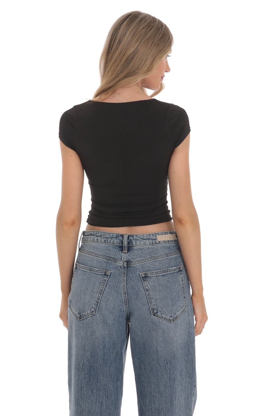 Picture Short Sleeve Crop Top in Black. Source: https://media-img.lucyinthesky.com/data/Feb24/850xAUTO/2baf26be-d0b1-45ac-90ed-2892c1d1dae7.jpg