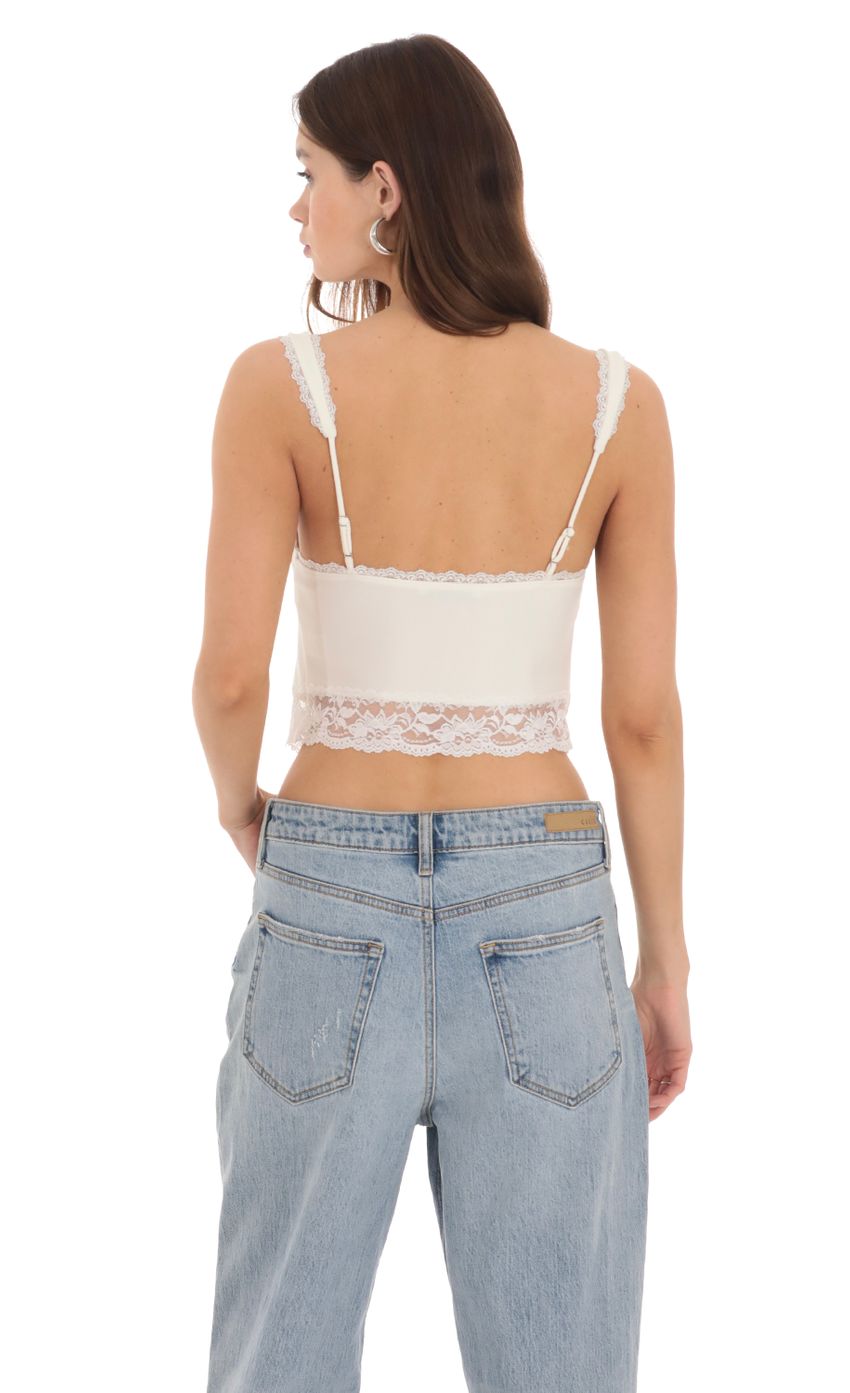 Picture Lace Vest Top in Cream. Source: https://media-img.lucyinthesky.com/data/Feb24/850xAUTO/2db1e905-fcb2-45ba-8533-c01f7421f856.jpg