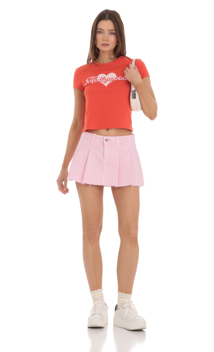 Picture Pleated Denim Mini Skirt in Pink. Source: https://media-img.lucyinthesky.com/data/Feb24/850xAUTO/2de11012-8cdd-4251-b152-742981c3ef15.jpg