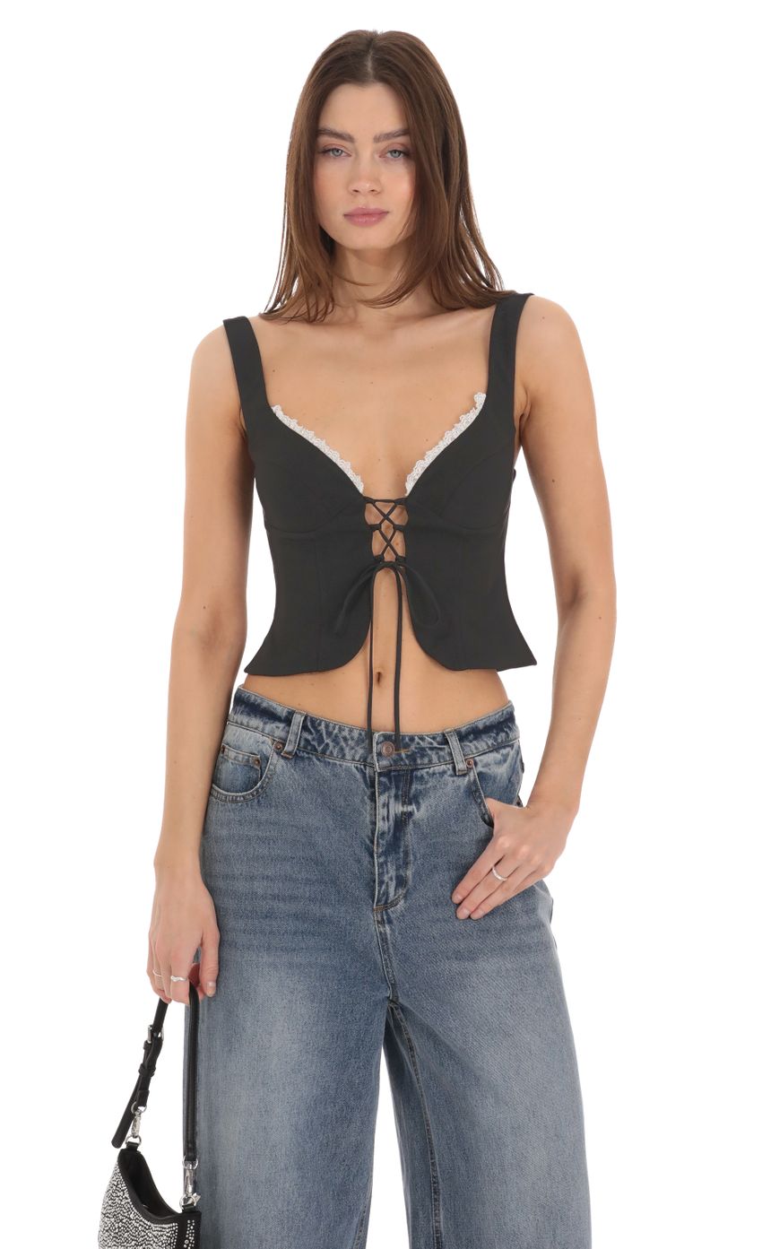 Picture Front Tie Vest Top in Black. Source: https://media-img.lucyinthesky.com/data/Feb24/850xAUTO/300a30d3-ecbb-41a0-aab6-23bebe3db370.jpg