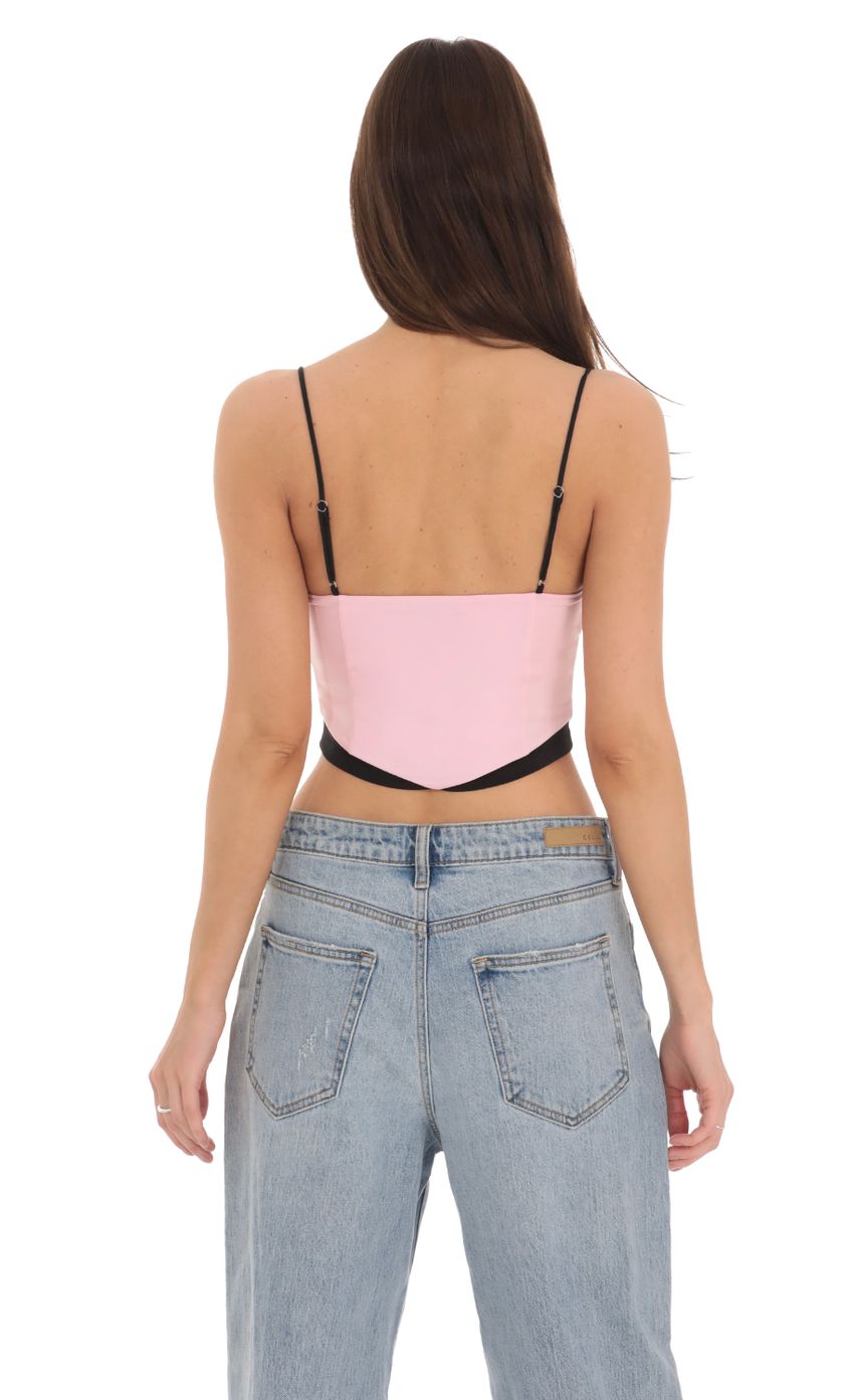 Picture Black Trim Crop Top in Pink. Source: https://media-img.lucyinthesky.com/data/Feb24/850xAUTO/31e0d513-0caa-4d55-ac7c-79f511d361f6.jpg