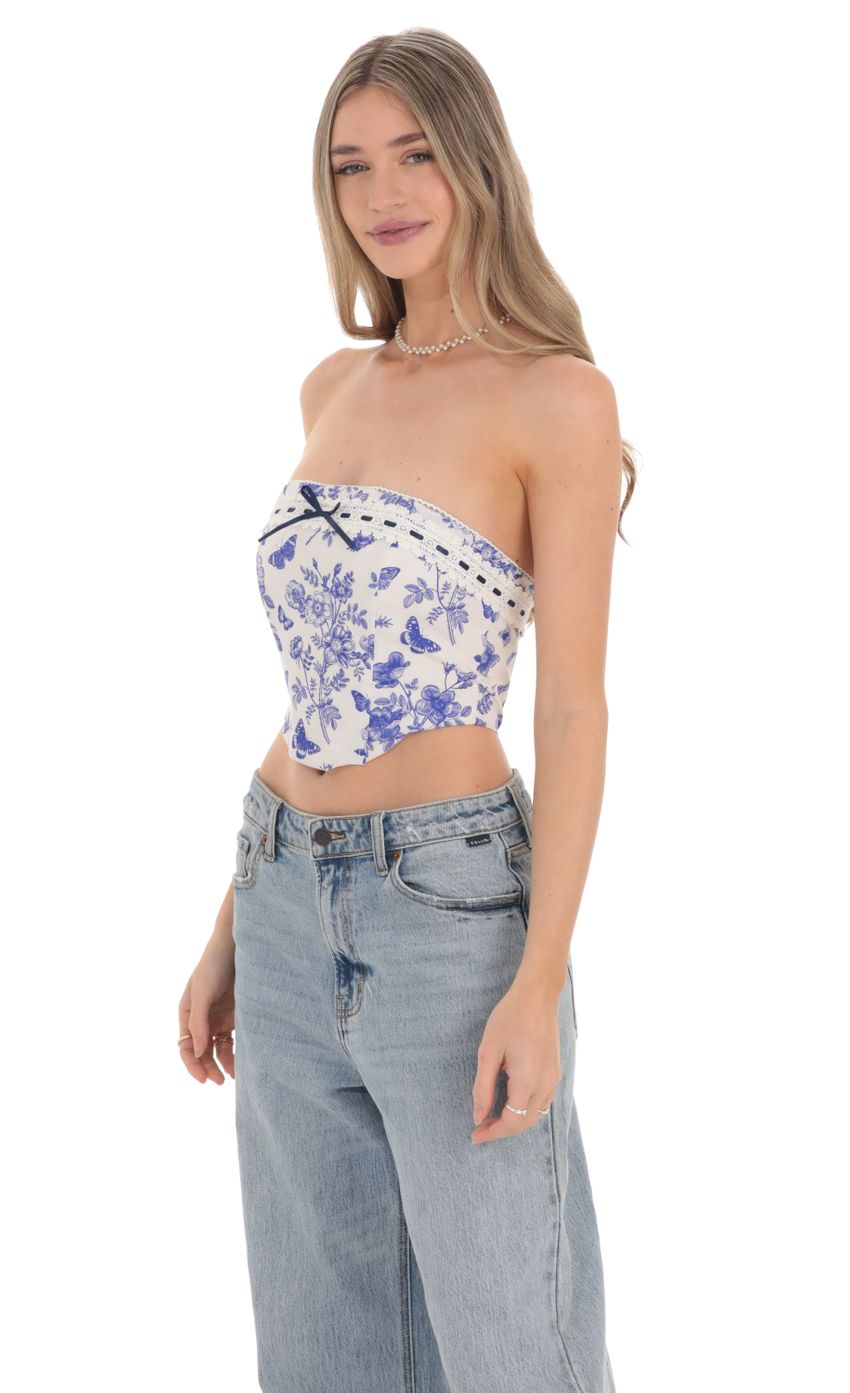 Picture Blue Floral Corset Top in White. Source: https://media-img.lucyinthesky.com/data/Feb24/850xAUTO/355689d2-7f45-4071-b6ba-2757941989bf.jpg
