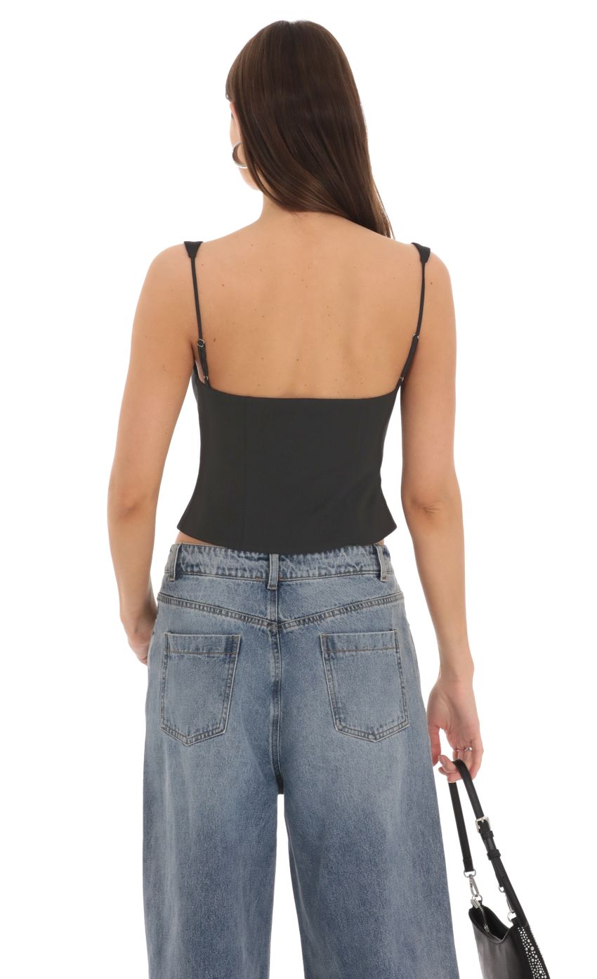 Picture Front Tie Vest Top in Black. Source: https://media-img.lucyinthesky.com/data/Feb24/850xAUTO/3578b4e8-f4dc-416c-83e1-aee068a8845f.jpg