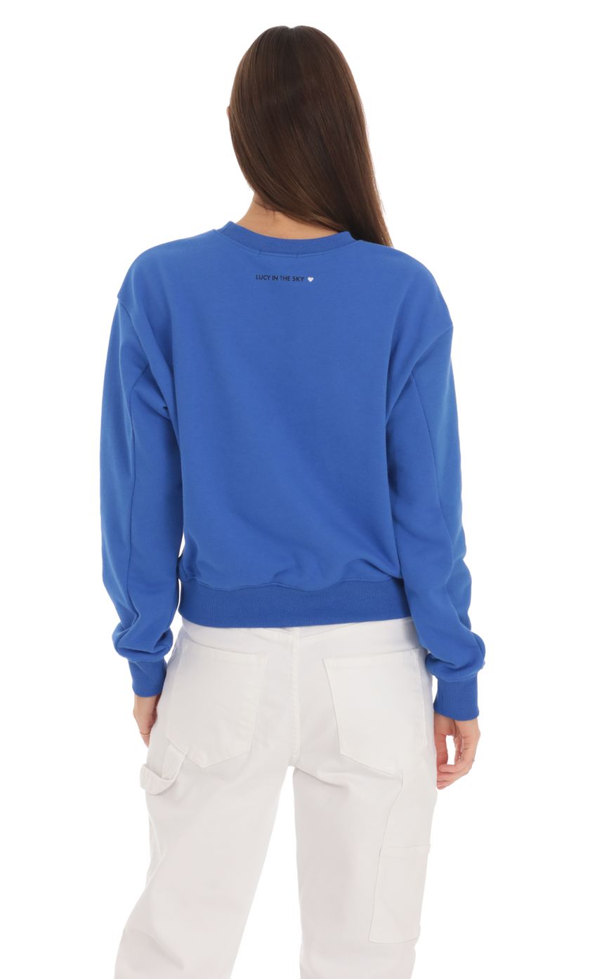 Picture Beverly Hills 90210 Jumper in Blue. Source: https://media-img.lucyinthesky.com/data/Feb24/850xAUTO/39c9095d-6eae-4de3-b2f8-e2bded436fba.jpg