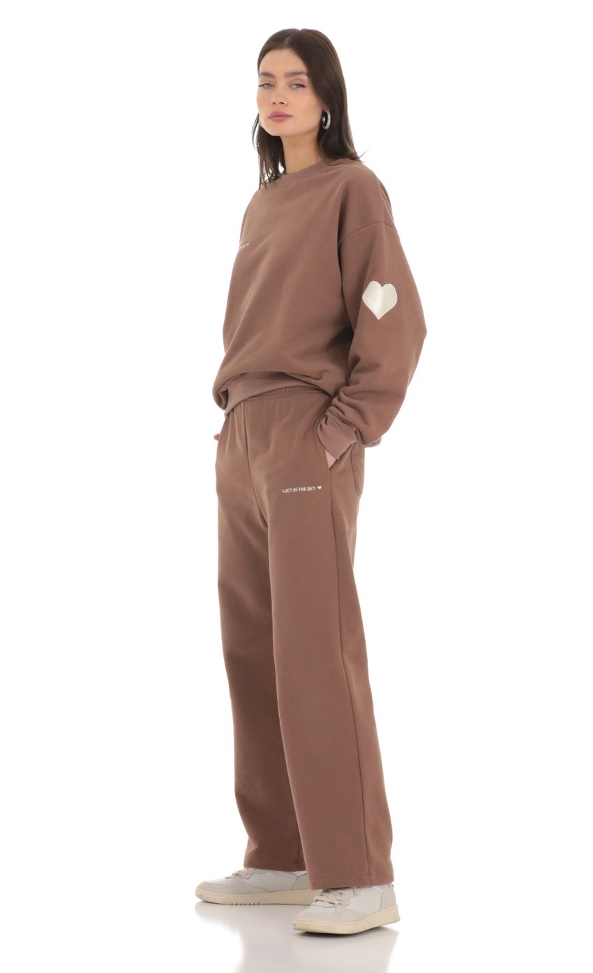 Picture Heart Pocket Sweatpants in Brown. Source: https://media-img.lucyinthesky.com/data/Feb24/850xAUTO/3f49925f-7449-4f5c-b494-1c3a8431025d.jpg