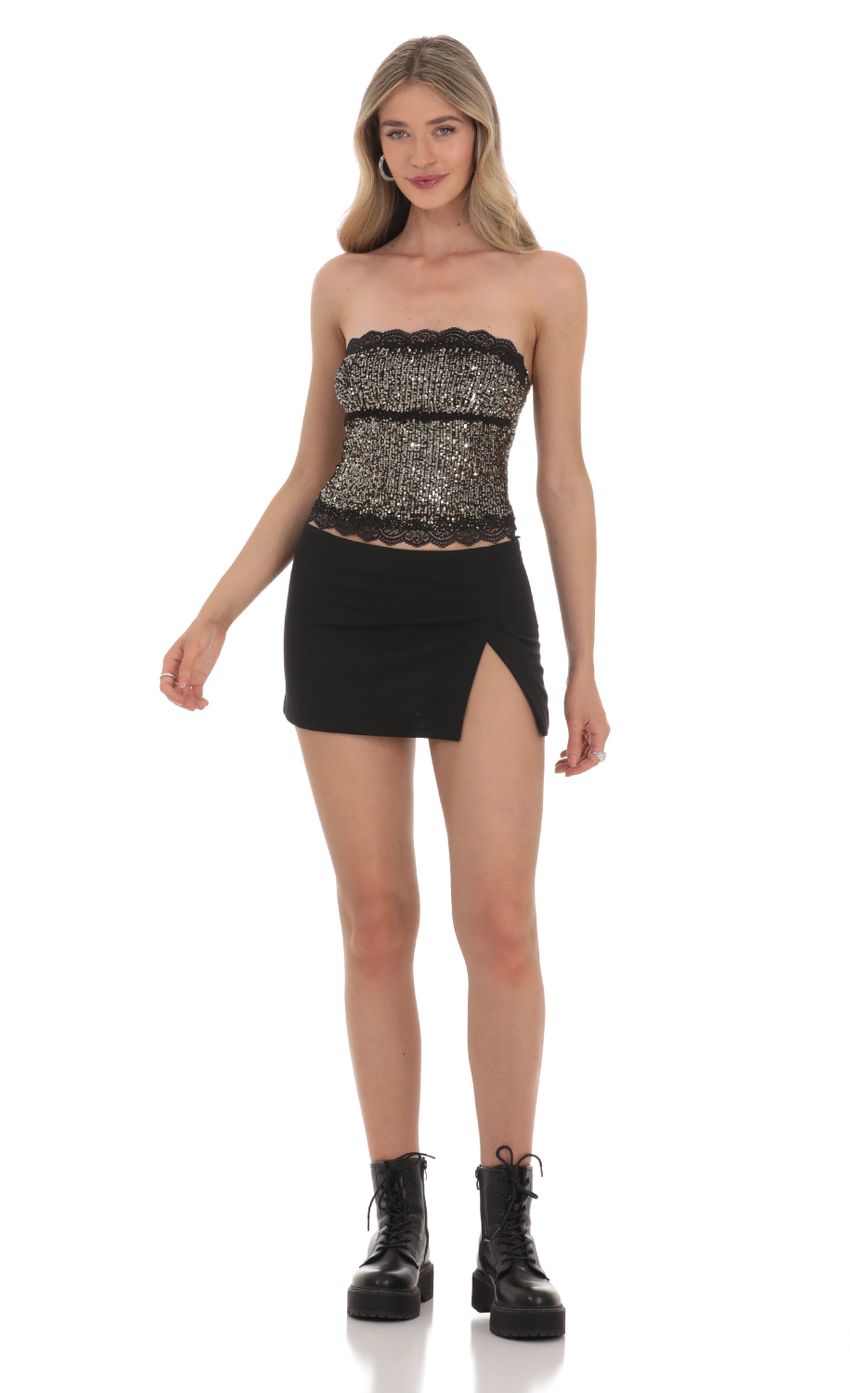 Picture Strapless Gold Sequin Top in Black. Source: https://media-img.lucyinthesky.com/data/Feb24/850xAUTO/4a8ce55c-d2f8-4bef-afaa-6b3b50e02bec.jpg
