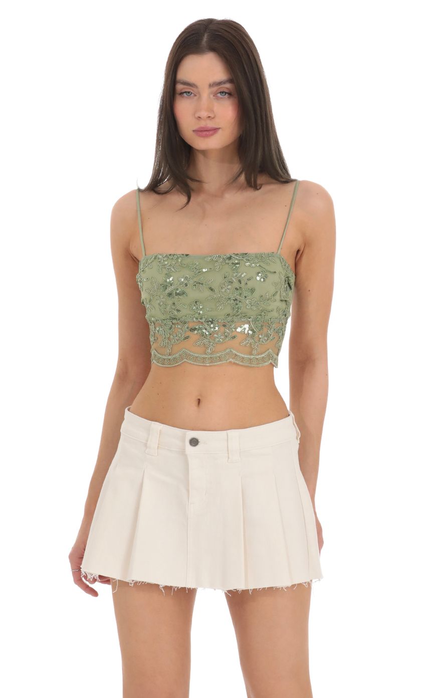 Picture Sequin Embroidered Top in Green. Source: https://media-img.lucyinthesky.com/data/Feb24/850xAUTO/52b374e8-4504-4781-8c80-120af86a49a1.jpg