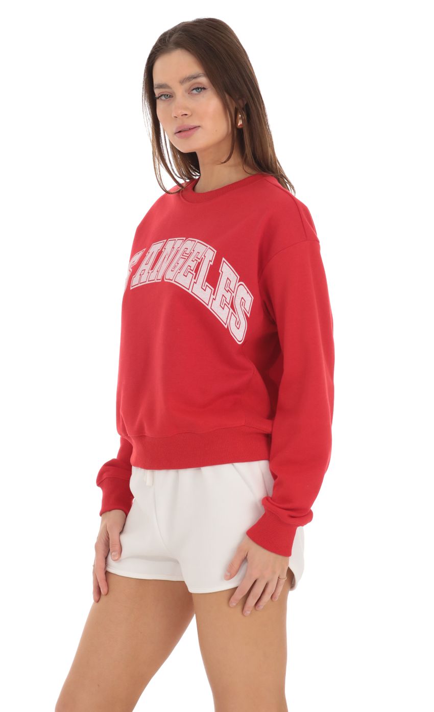 Picture Los Angeles Jumper in Red. Source: https://media-img.lucyinthesky.com/data/Feb24/850xAUTO/53417f50-ff1b-4eda-9f45-e338652090be.jpg