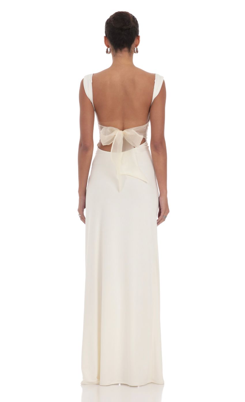 Picture Open Back Bow Maxi Dress in White. Source: https://media-img.lucyinthesky.com/data/Feb24/850xAUTO/59be2ca0-5555-4114-8cdc-8812ad06a571.jpg