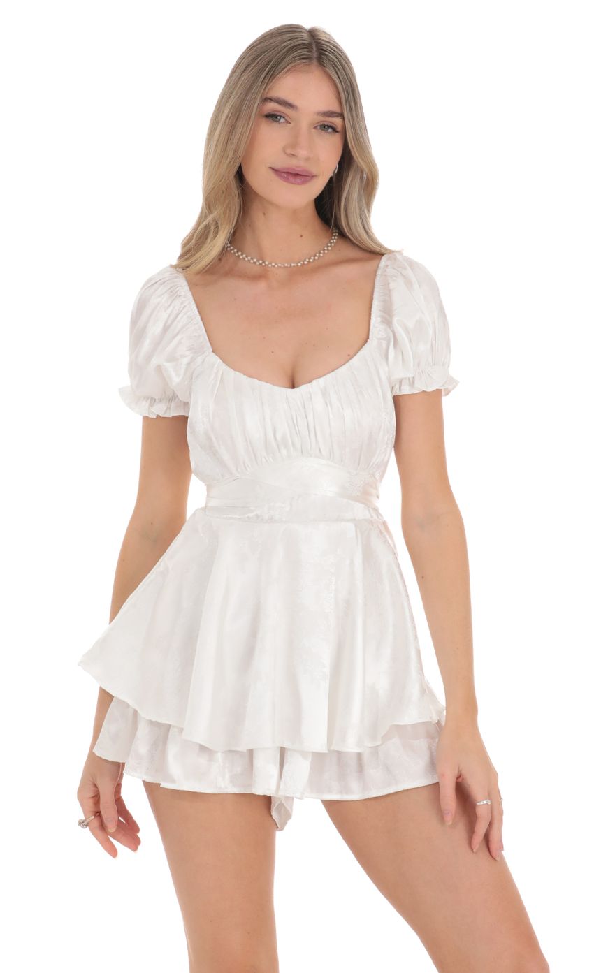 Picture Puff Sleeve Satin Romper in White. Source: https://media-img.lucyinthesky.com/data/Feb24/850xAUTO/5ee86359-2219-4452-876f-73ee90f6b417.jpg