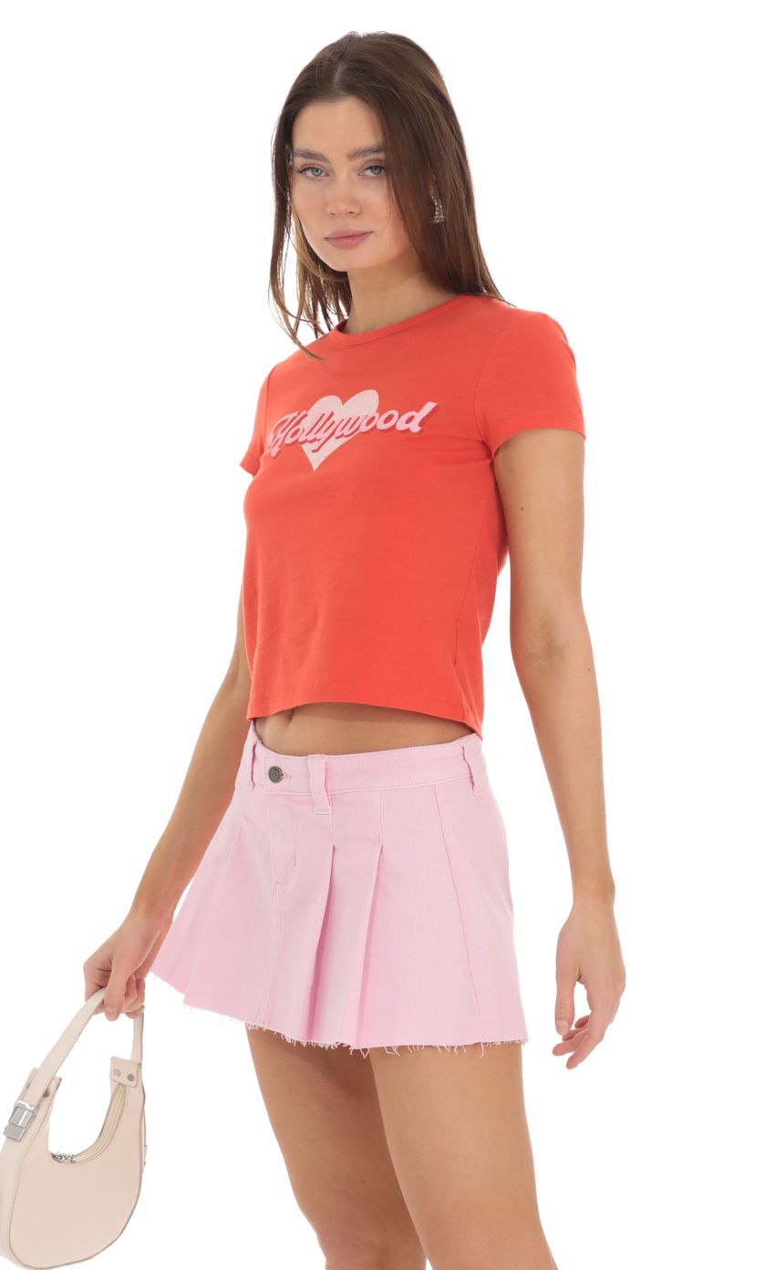 Picture Pleated Denim Mini Skirt in Pink. Source: https://media-img.lucyinthesky.com/data/Feb24/850xAUTO/60c49483-3011-4eee-980b-8c2780518e6c.jpg
