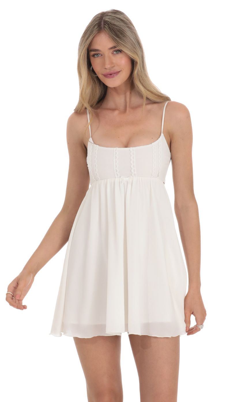 Picture Embroidered Babydoll Dress in White. Source: https://media-img.lucyinthesky.com/data/Feb24/850xAUTO/6127d868-4b54-4696-b29d-ccdbdf6e2bc7.jpg