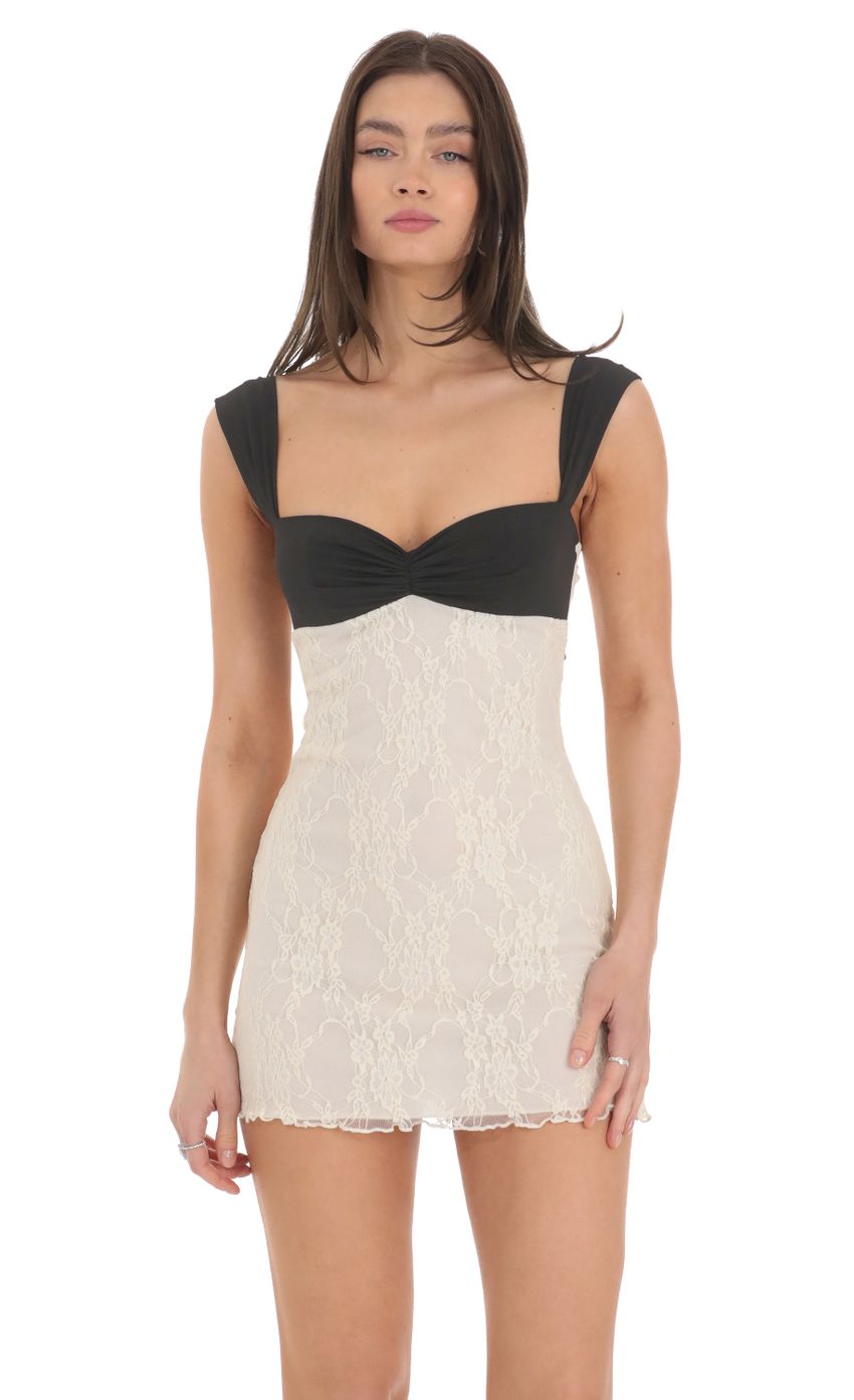 Picture Two Toned Lace Dress in Black and Cream. Source: https://media-img.lucyinthesky.com/data/Feb24/850xAUTO/6649c20d-b8cc-43e9-8273-b1f1802887d7.jpg