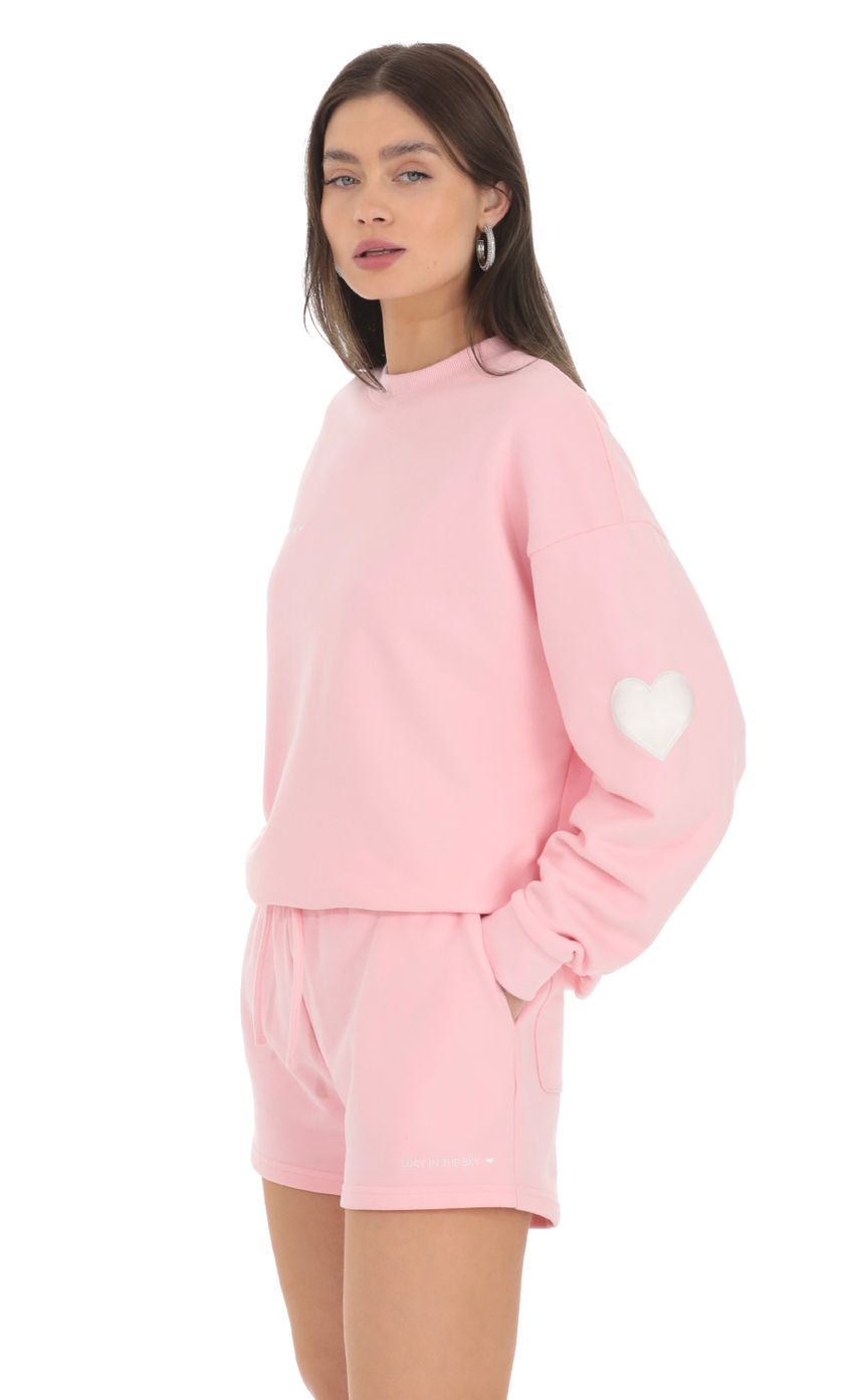 Picture Embroidered Lucy in the Sky Jumper in Pink. Source: https://media-img.lucyinthesky.com/data/Feb24/850xAUTO/7a720324-f33b-4dbb-9f96-9d970fda1a21.jpg