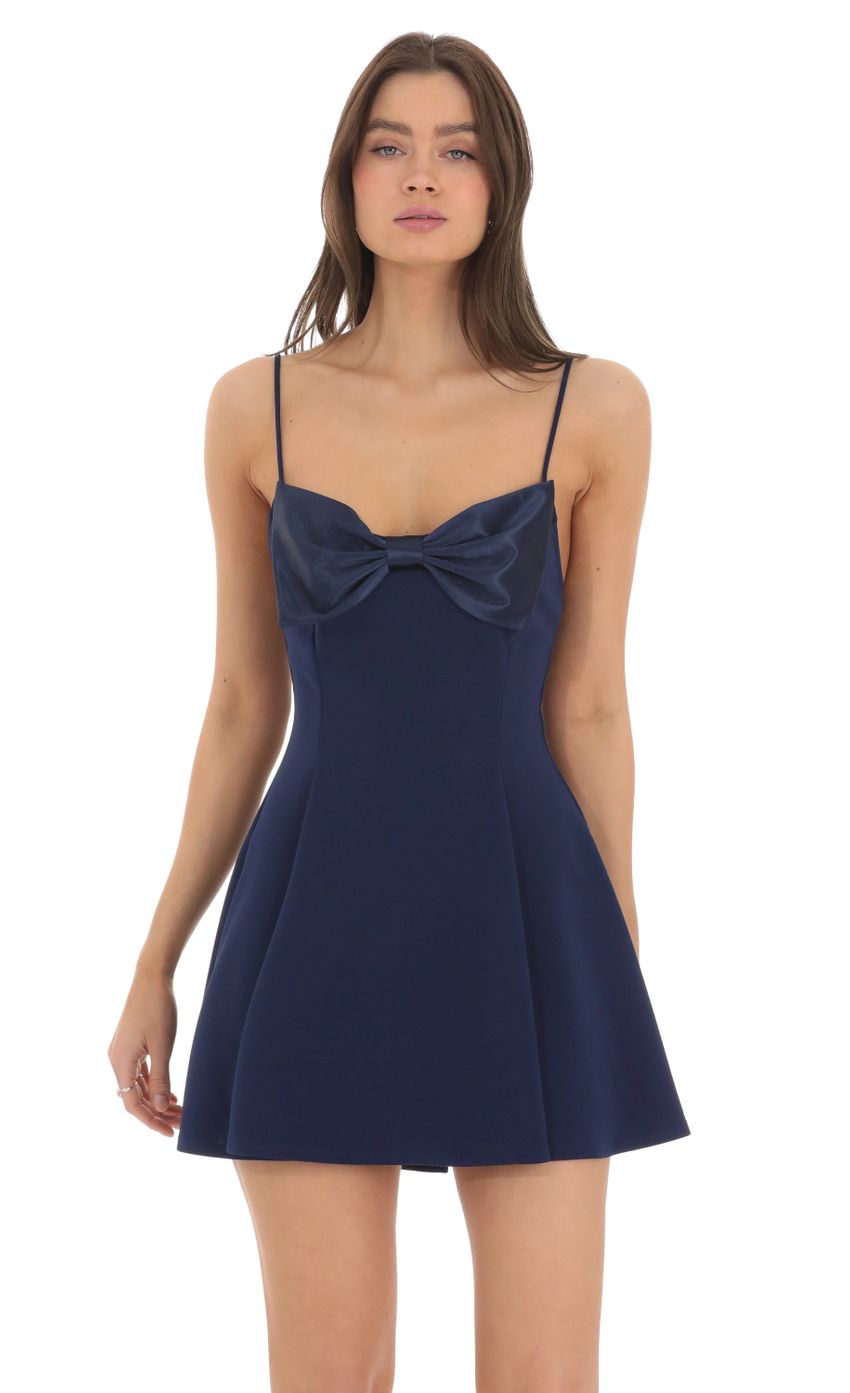 Picture Front Bow A-line Dress in Navy. Source: https://media-img.lucyinthesky.com/data/Feb24/850xAUTO/7c35aead-cd6a-4097-8a0e-c2ee852bc72d.jpg