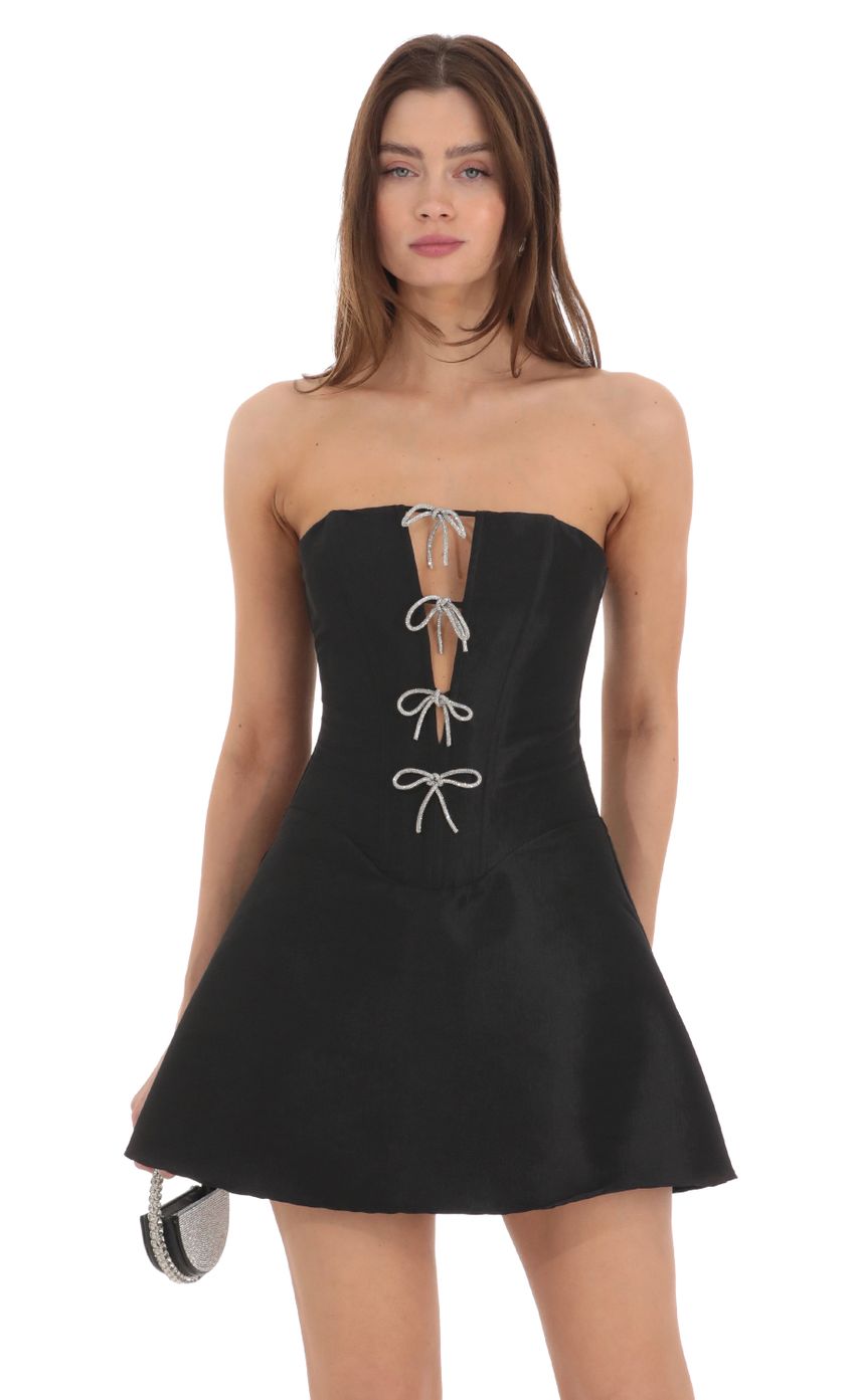 Picture Strapless Rhinestone Bow Dress in Black. Source: https://media-img.lucyinthesky.com/data/Feb24/850xAUTO/88b75f27-e48e-4a69-b861-296c737b34d0.jpg