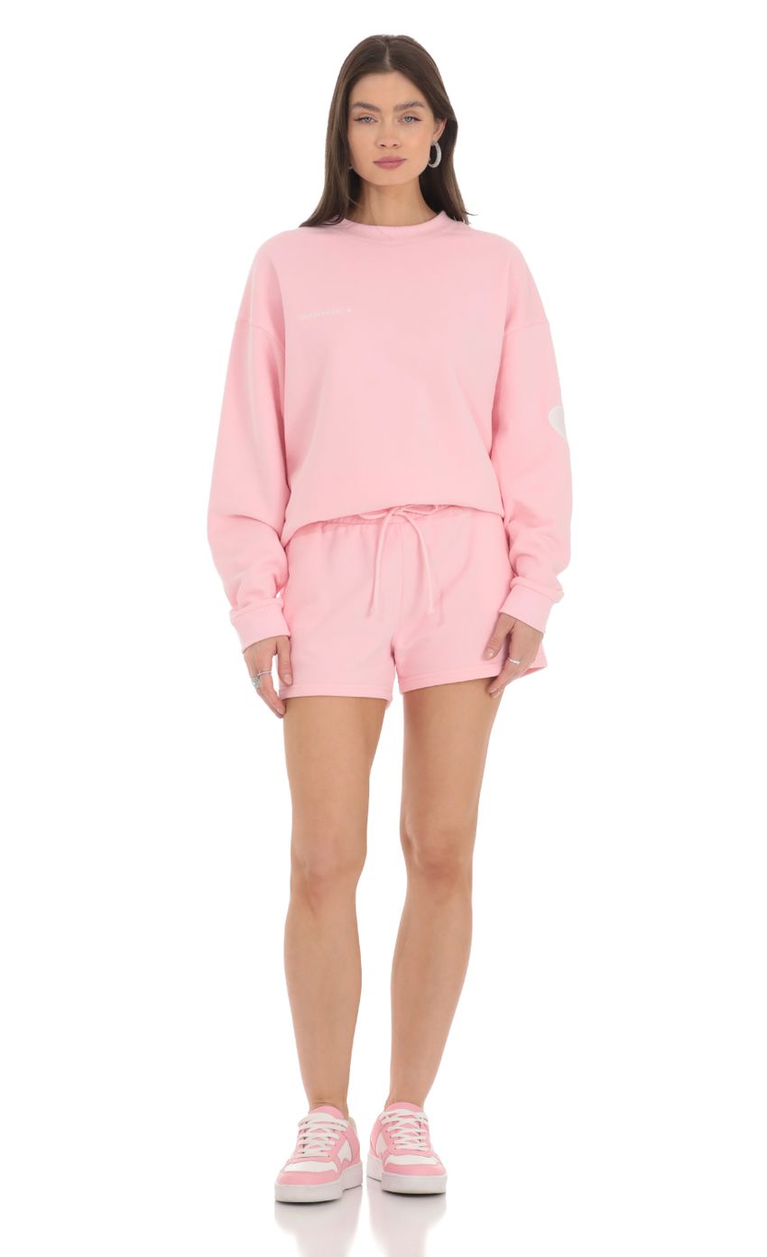 Picture Embroidered Lucy in the Sky Jumper in Pink. Source: https://media-img.lucyinthesky.com/data/Feb24/850xAUTO/a02113b2-08b7-4c18-ba45-79c2eba5d300.jpg
