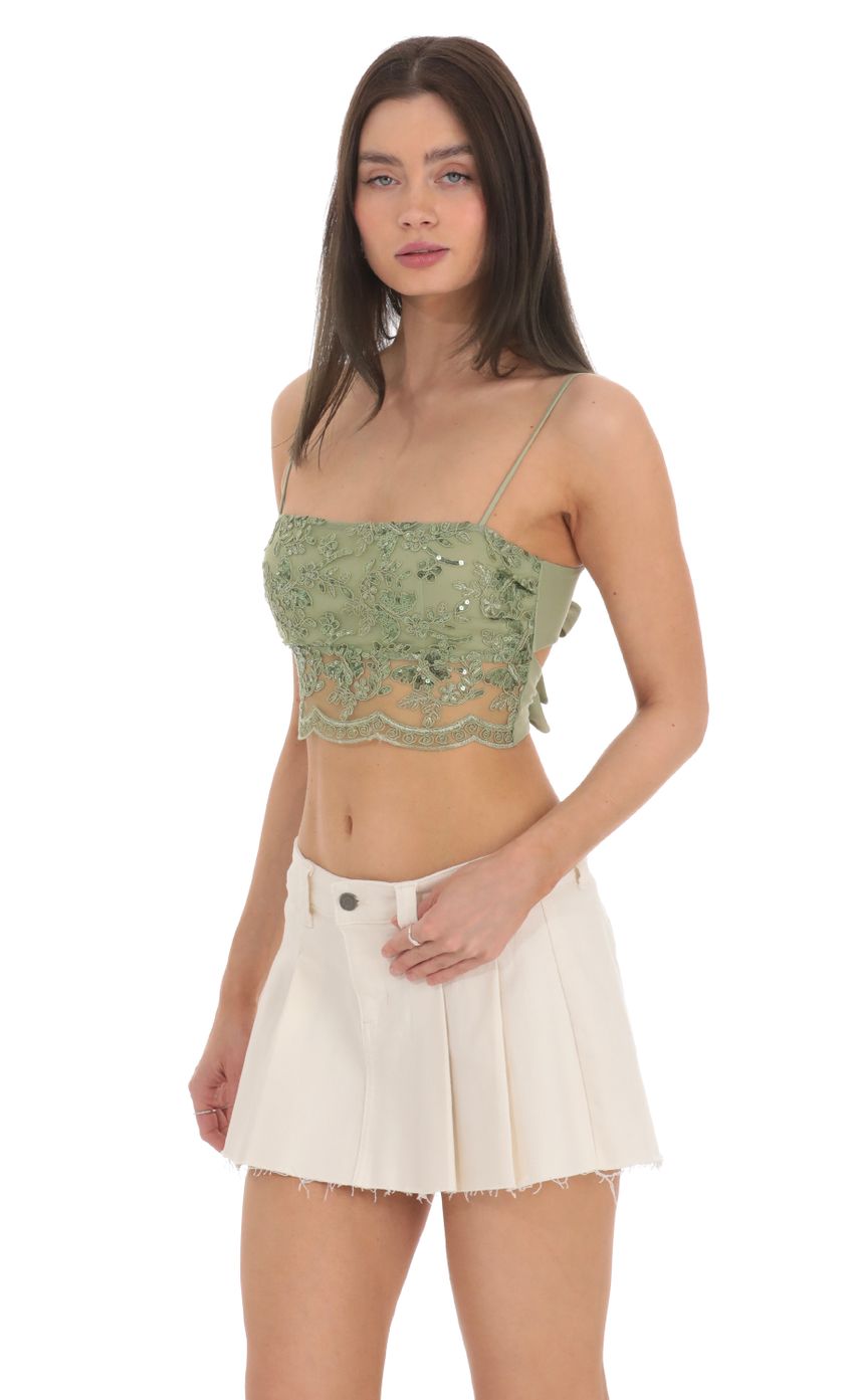 Picture Sequin Embroidered Top in Green. Source: https://media-img.lucyinthesky.com/data/Feb24/850xAUTO/a18f8e61-9a24-421e-85c2-3b23075bf9b8.jpg