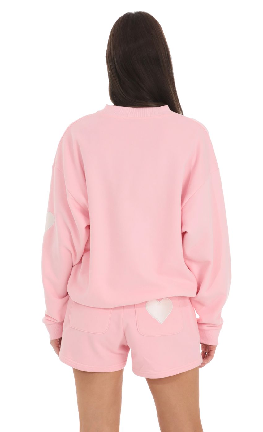 Picture Embroidered Lucy in the Sky Jumper in Pink. Source: https://media-img.lucyinthesky.com/data/Feb24/850xAUTO/a695f42d-af7c-4a07-9a8b-4c9bef77cefd.jpg
