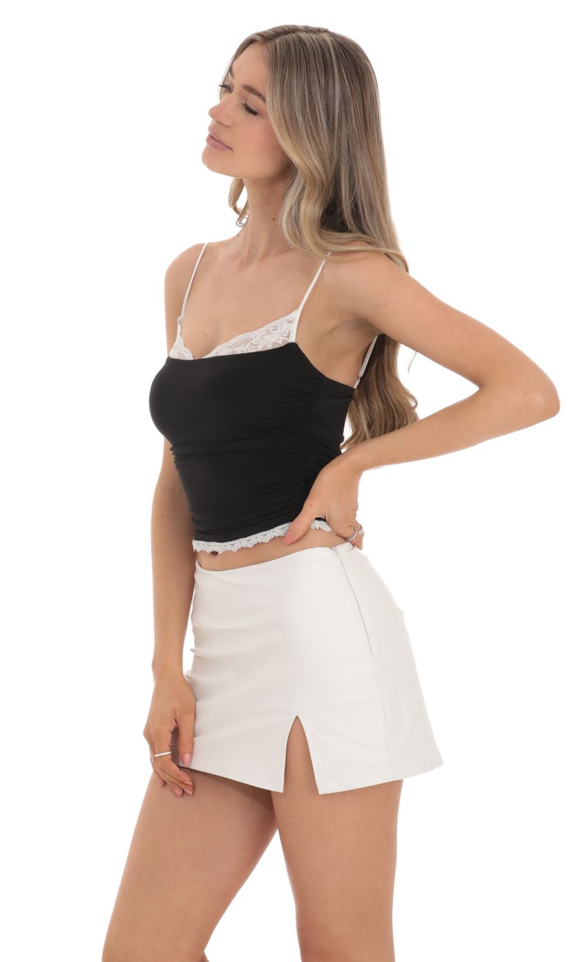 Picture Faux Leather Skort in White. Source: https://media-img.lucyinthesky.com/data/Feb24/850xAUTO/b51ee9ae-9085-427e-9731-d79b5e8e240f.jpg