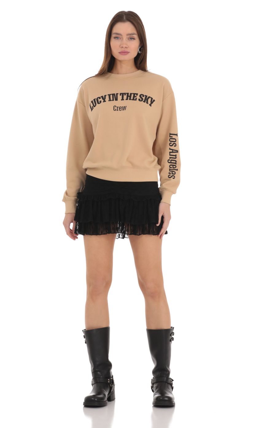 Picture Lucy in the Sky Crew Jumper in Brown. Source: https://media-img.lucyinthesky.com/data/Feb24/850xAUTO/d41ac8b5-e69a-44c3-bf2a-b5c926e32a9f.jpg