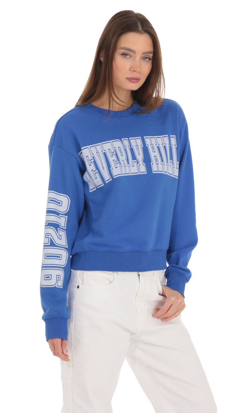 Picture Beverly Hills 90210 Jumper in Blue. Source: https://media-img.lucyinthesky.com/data/Feb24/850xAUTO/da144ff2-bc8f-4286-a5ee-c3e8eeb1c62a.jpg