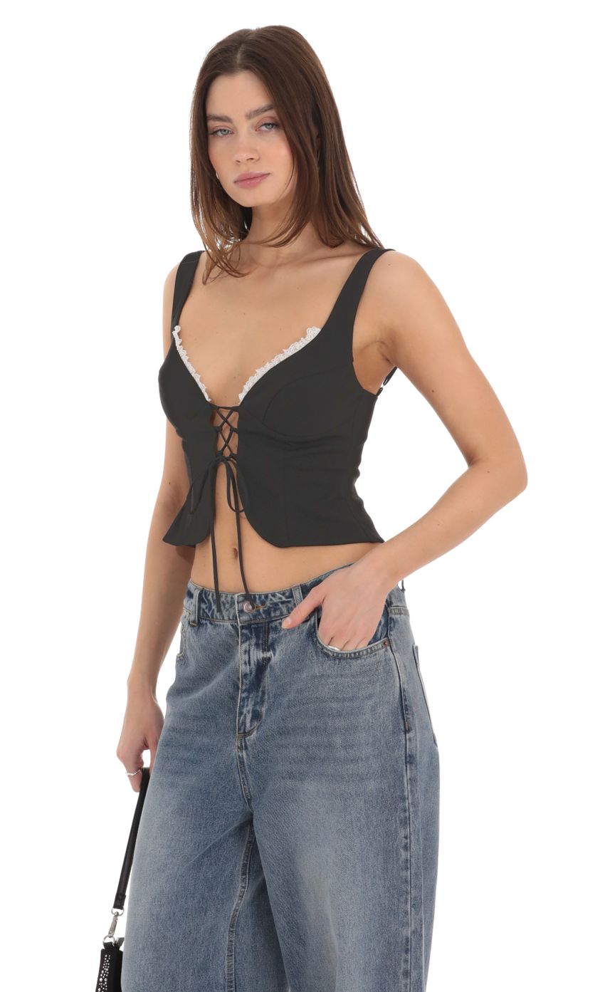 Picture Front Tie Vest Top in Black. Source: https://media-img.lucyinthesky.com/data/Feb24/850xAUTO/db69656b-21bf-4b0e-a288-4388483c507d.jpg