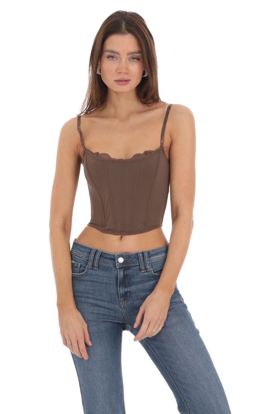 Picture Lace Corset Top in Brown. Source: https://media-img.lucyinthesky.com/data/Feb24/850xAUTO/f0f15a9d-8d5a-4daa-a0ec-f940b2bd4037.jpg