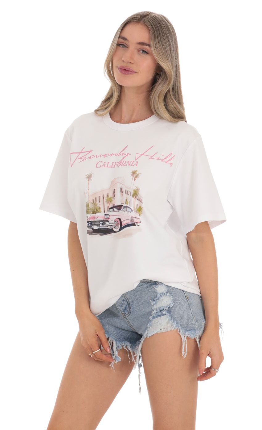 Picture Beverly Hills California Graphic T-Shirt in White. Source: https://media-img.lucyinthesky.com/data/Feb24/850xAUTO/f46001b0-ca6c-4e1c-bf0f-6c5c82a89e67.jpg