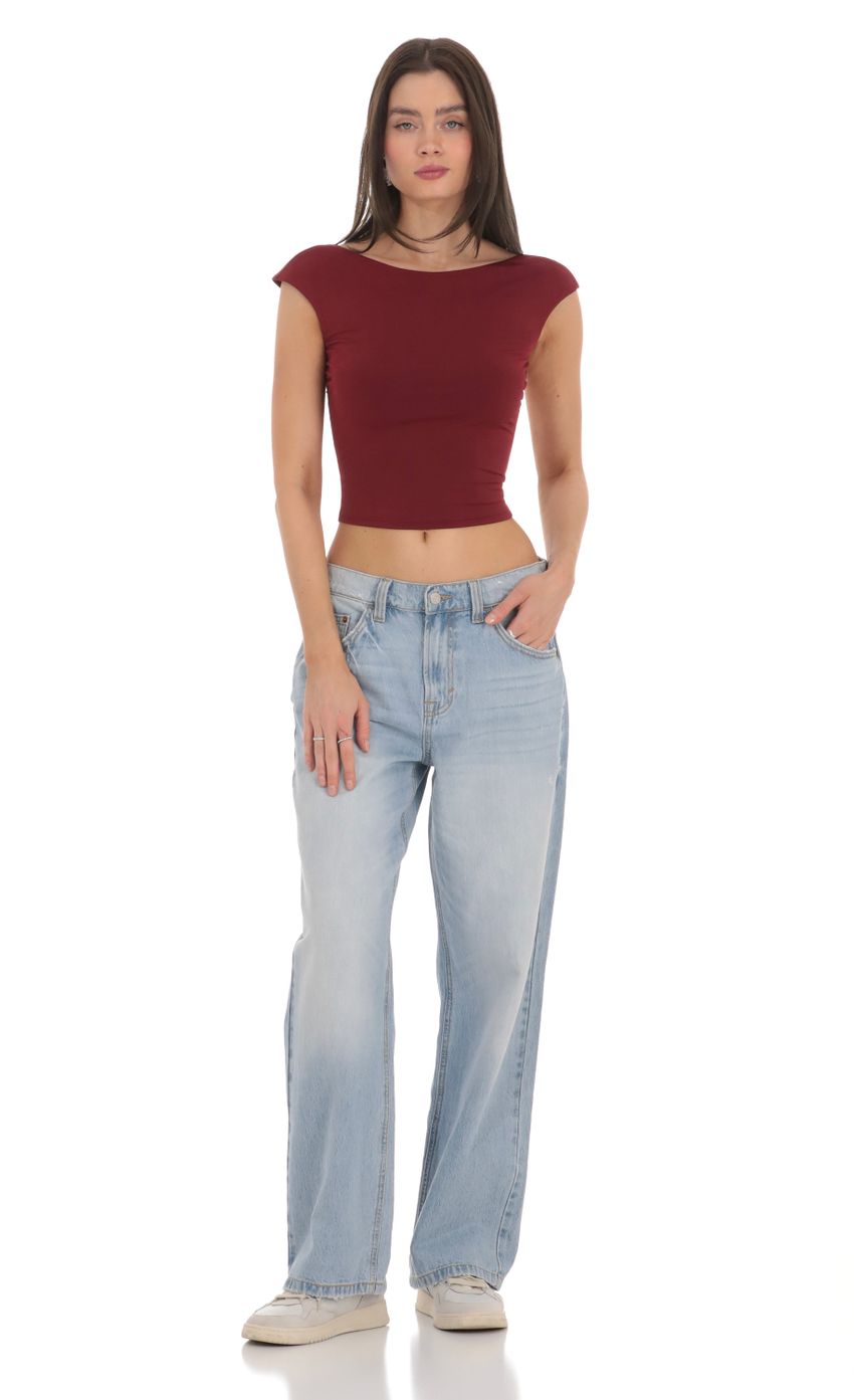 Picture High Neck Open Back Top in Maroon. Source: https://media-img.lucyinthesky.com/data/Feb24/850xAUTO/ffedf5fb-332b-49c4-a392-d5d062f1a7ab.jpg